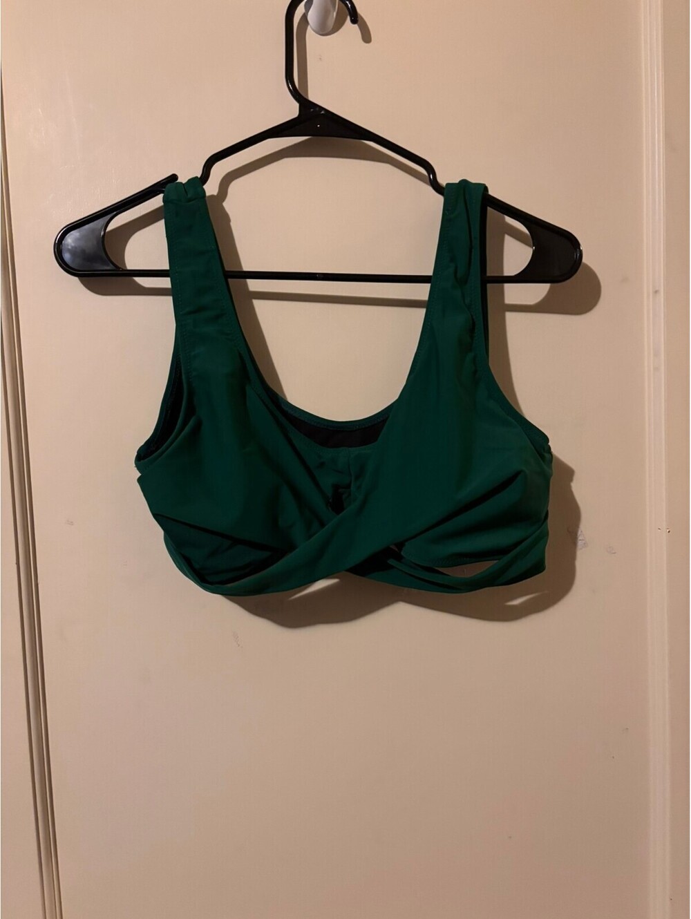 Womens green swim top with black mesh detail